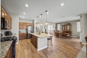 Open-concept kitchen with island in a Cadence at Gateway home
