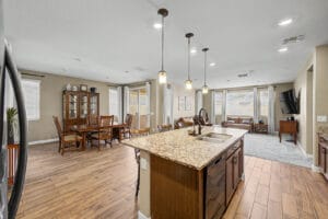 Kitchen with breakfast bar and ample cabinetry in this move-in-ready East Mesa home