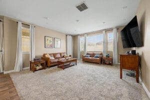 Open-concept great room with natural light in a Cadence at Gateway home