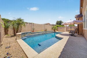 Backyard swimming pool view at this move-in-ready Mesa home