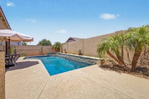 Pool and outdoor living space at a Cadence at Gateway home for sale in Mesa, AZ 85212