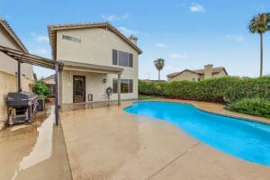 Two-story home with private pool, covered patio and hedge-lined backyard in Glendale, AZ