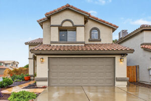 Two-story stucco home with tile roof and two-car garage in Glendale, AZ