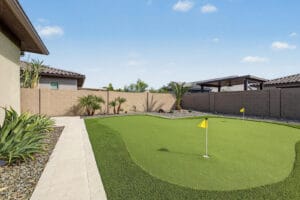 Three-hole putting green with synthetic turf and palms