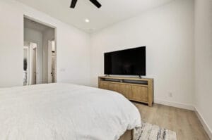 Furnished third bedroom with wood-like vinyl plank flooring
