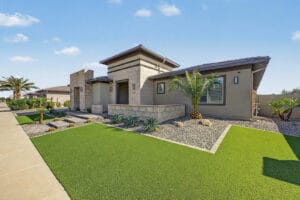 Contemporary front facade with stone accents and low-water landscaping