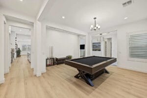 Self-cleaning heated pool with putting green and covered patio at 1255 E Mead Dr, Gilbert, AZ