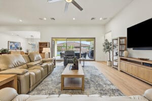 Great room opening to the covered patio, pool and putting green