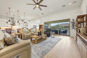 Great room seating area with recessed lighting and plantation shutters
