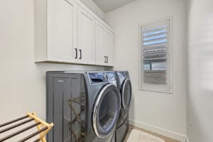 Laundry room with Electrolux washer and dryer included