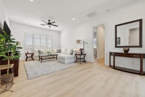 Furnished media room with wood-like vinyl plank flooring