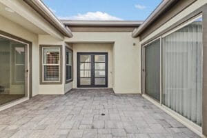 Private paver courtyard inside the covered front entry