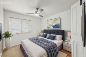 Virtually staged bedroom with upholstered king bed, nightstands and ceiling fan